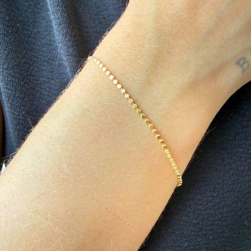 Pulseira Mini Bolinhas Achatadas 15cm + 5cm Banhado a Ouro 18k